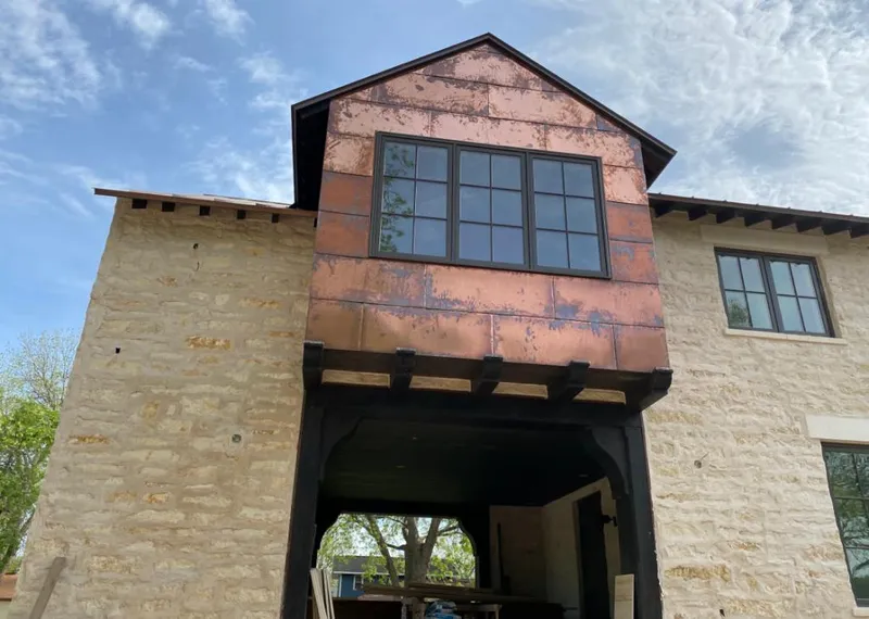 Copper metal panel facade on a stone building for Roof Repair in Capitola
