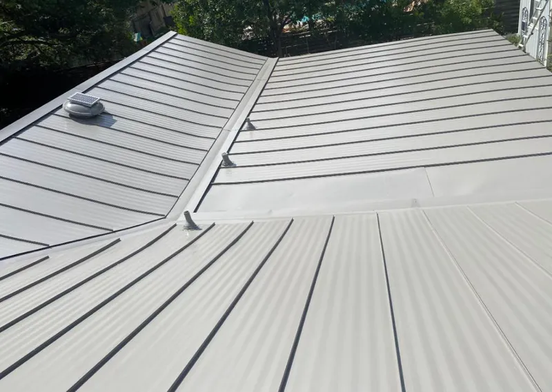 Solar attic fan installed on a metal roof for Roof Ventilation in Capitola
